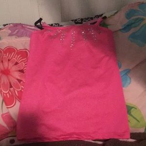 This is a sparkly pink gymnastics top for girls